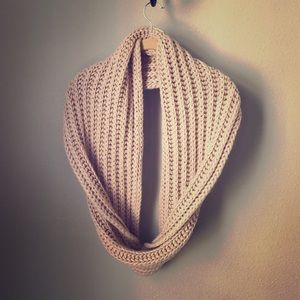 Pale pink large cable knit infinity scarf.